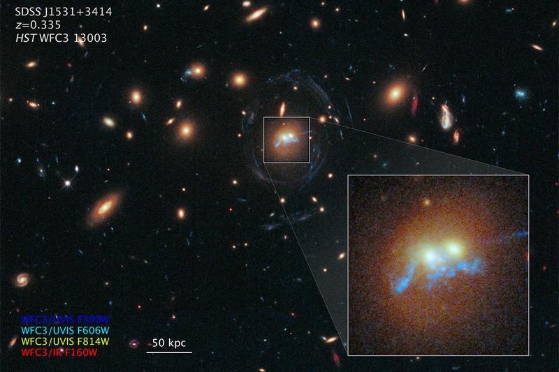 Podul stelar spiralat rotindu-se in jurul centrelor a doua galaxii batrane care fuzioneaza, Foto: NASA/ESA