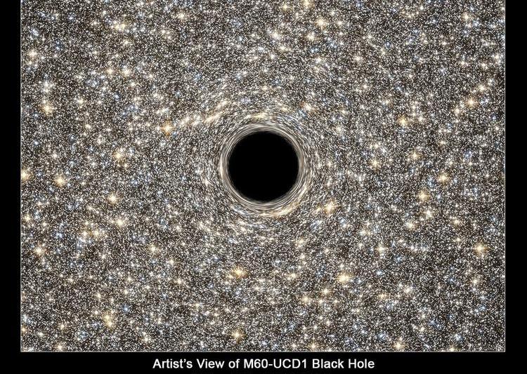 Redare artistica: Gaura neagra din centrul galaxiei M60-UCD1, Foto: NASA, ESA, STScI-RCC14-41a