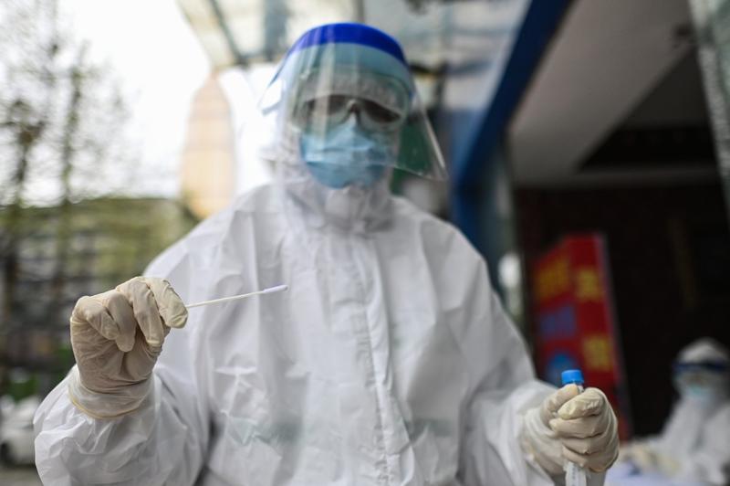 Test pentru coronavirus - COVID-19, Foto: Profimedia Images /Hector RETAMAL/AFP