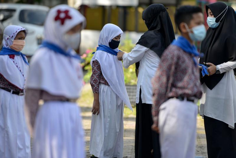 Fete la o scoala din Indonezia, Foto: CHAIDEER MAHYUDDIN / AFP / Profimedia