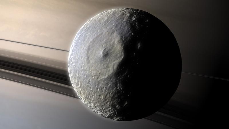 Luna Mimas orbitand in jurul lui Saturn (reprezentare artistica), Foto: Mark Garlick / Sciencephoto / Profimedia Images