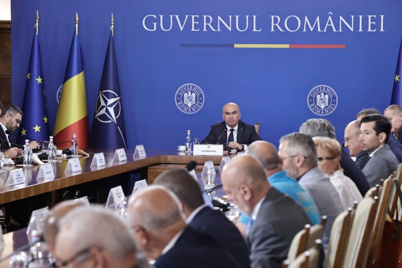 Sindicaliștii și patronatele, nemulțumiți după discuțiile cu Bolojan